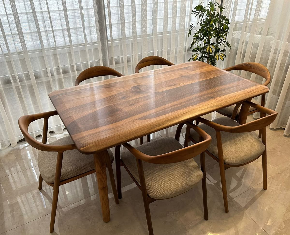 Custom wooden dining table by WoodKarigari